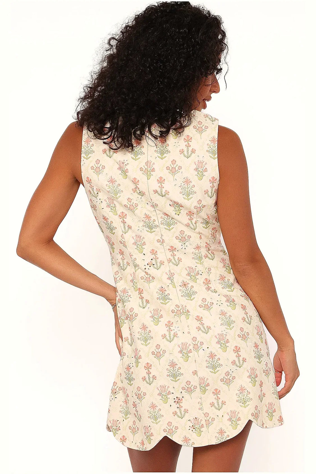Close view of the floral pattern on the coral cotton mini dress