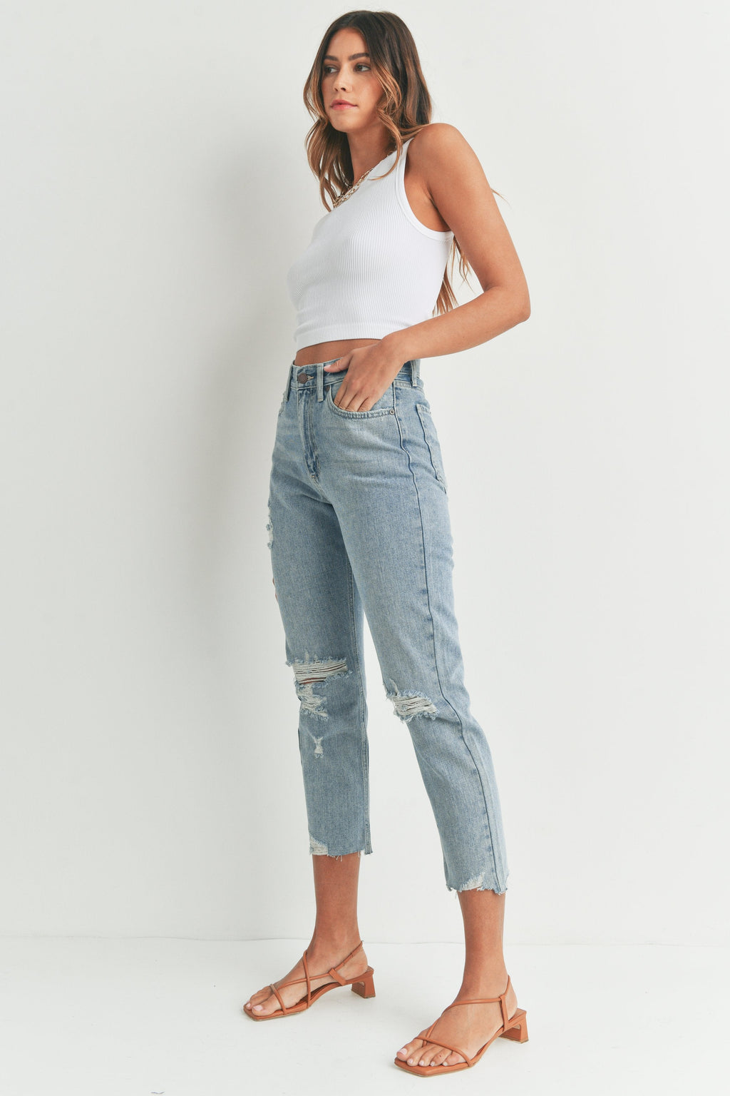 Distressed knees on a mid-rise denim