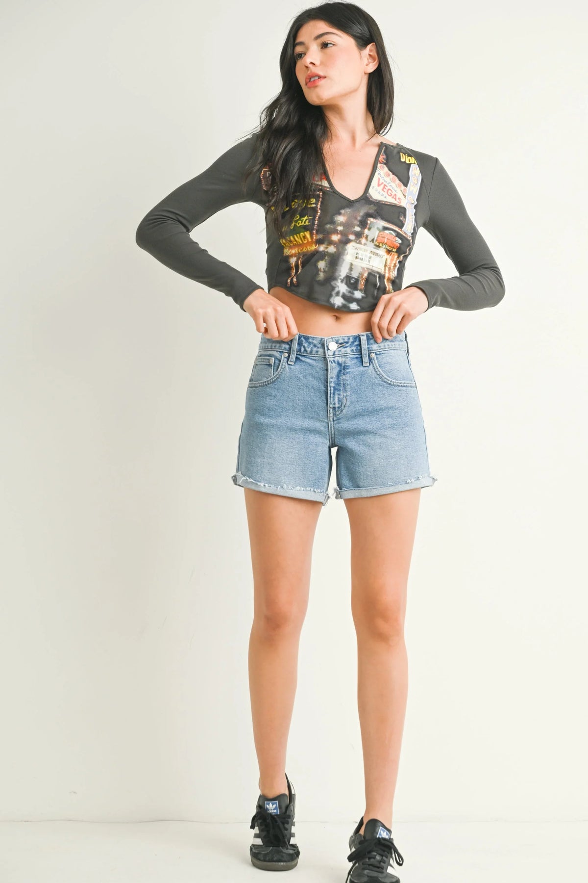 Cuffed hem with frayed edges on a mid-rise denim short