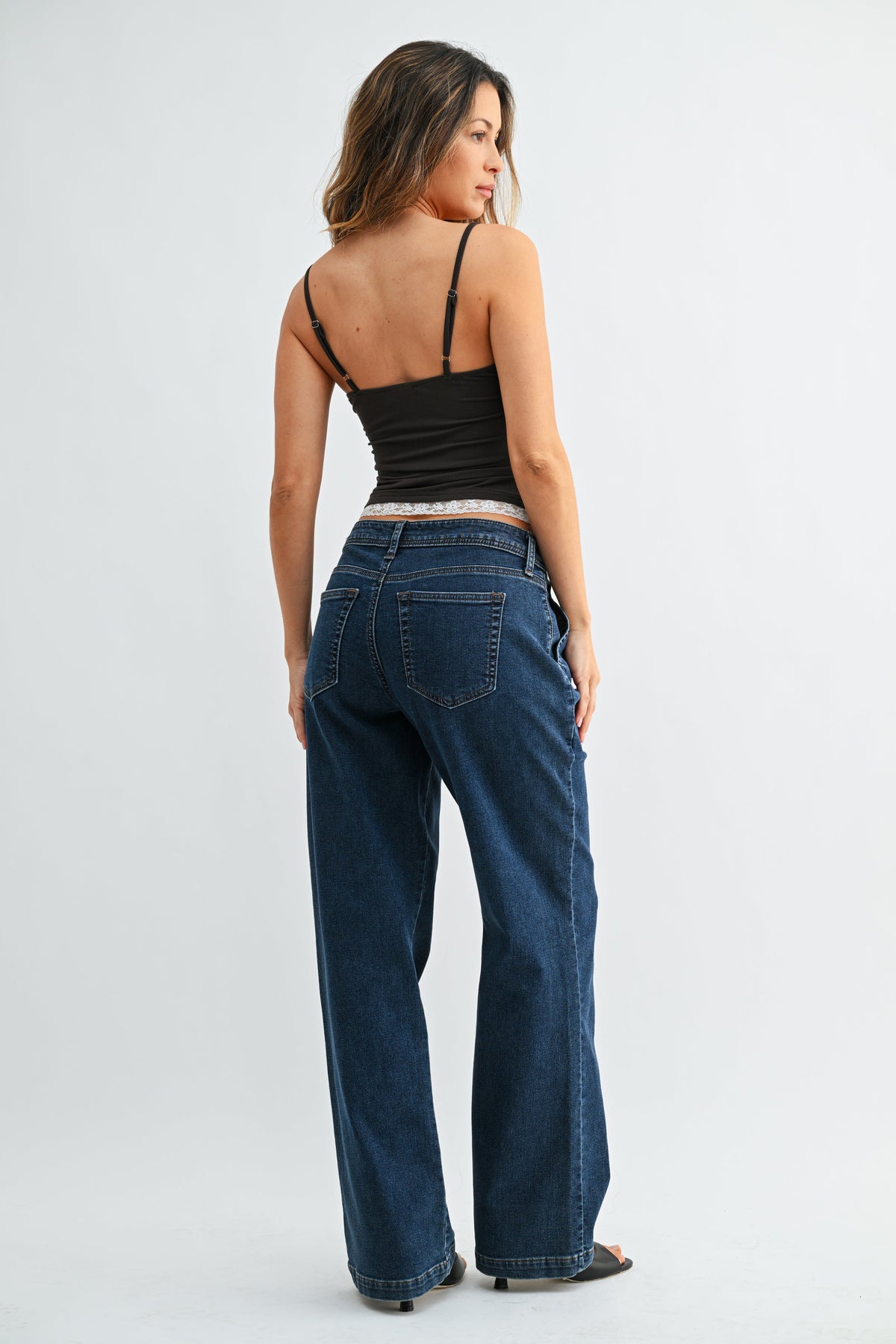 Full-length inseam creating an elongated denim silhouette