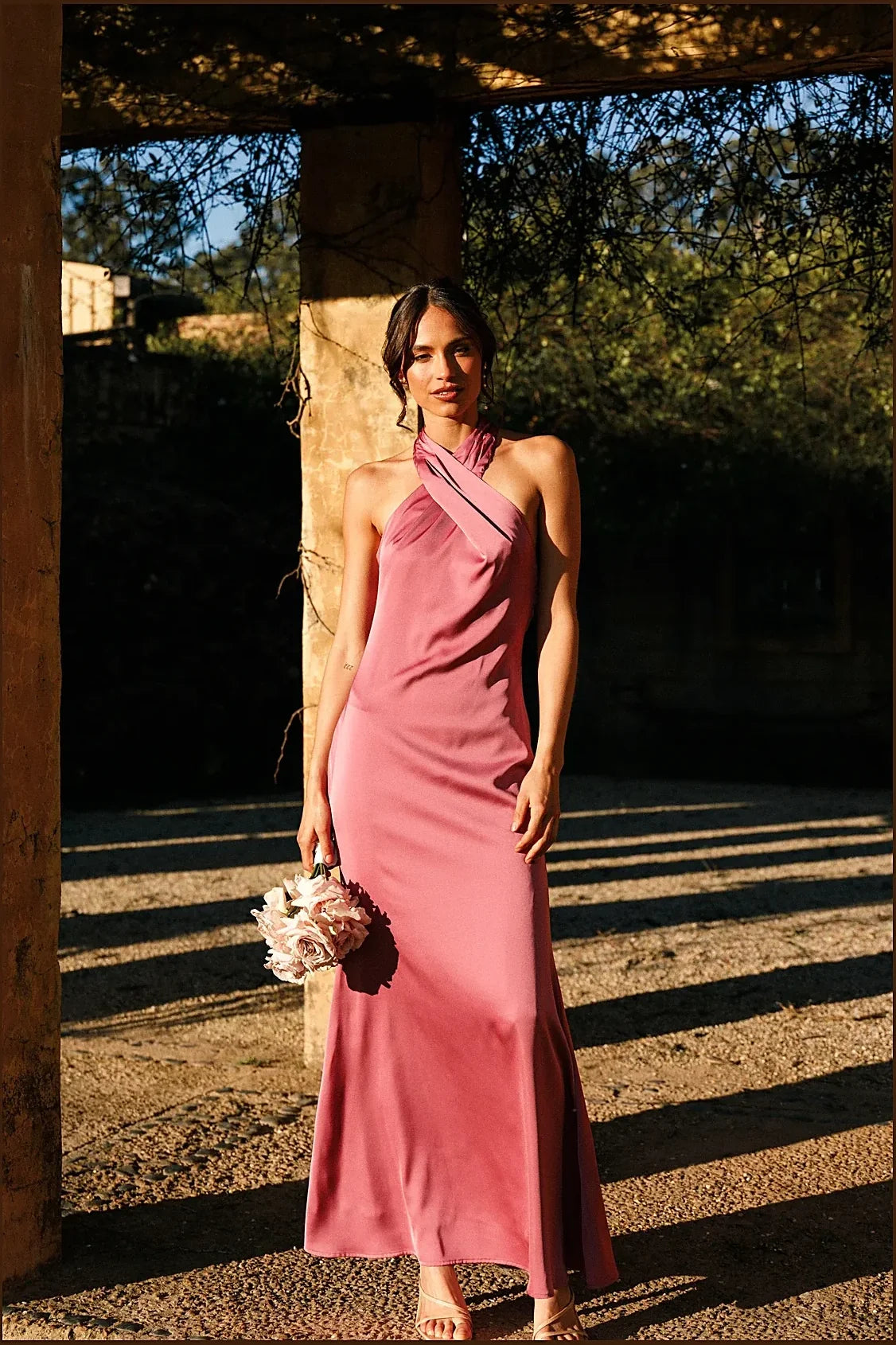 Back view of the dark rose satin maxi dress with halterneck