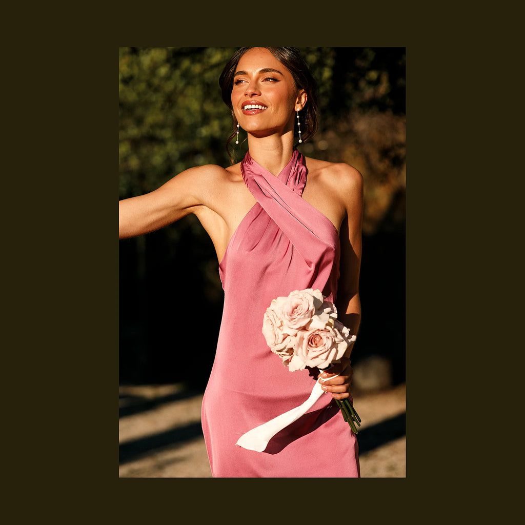 Sleeveless floor-length dress with a button close at the neck