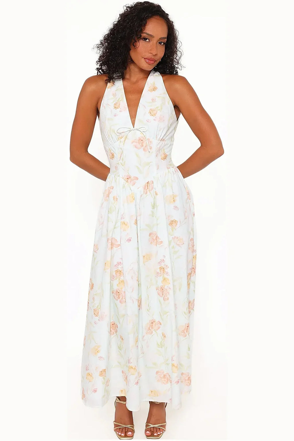Back view of the light mint halterneck maxi showing the open back