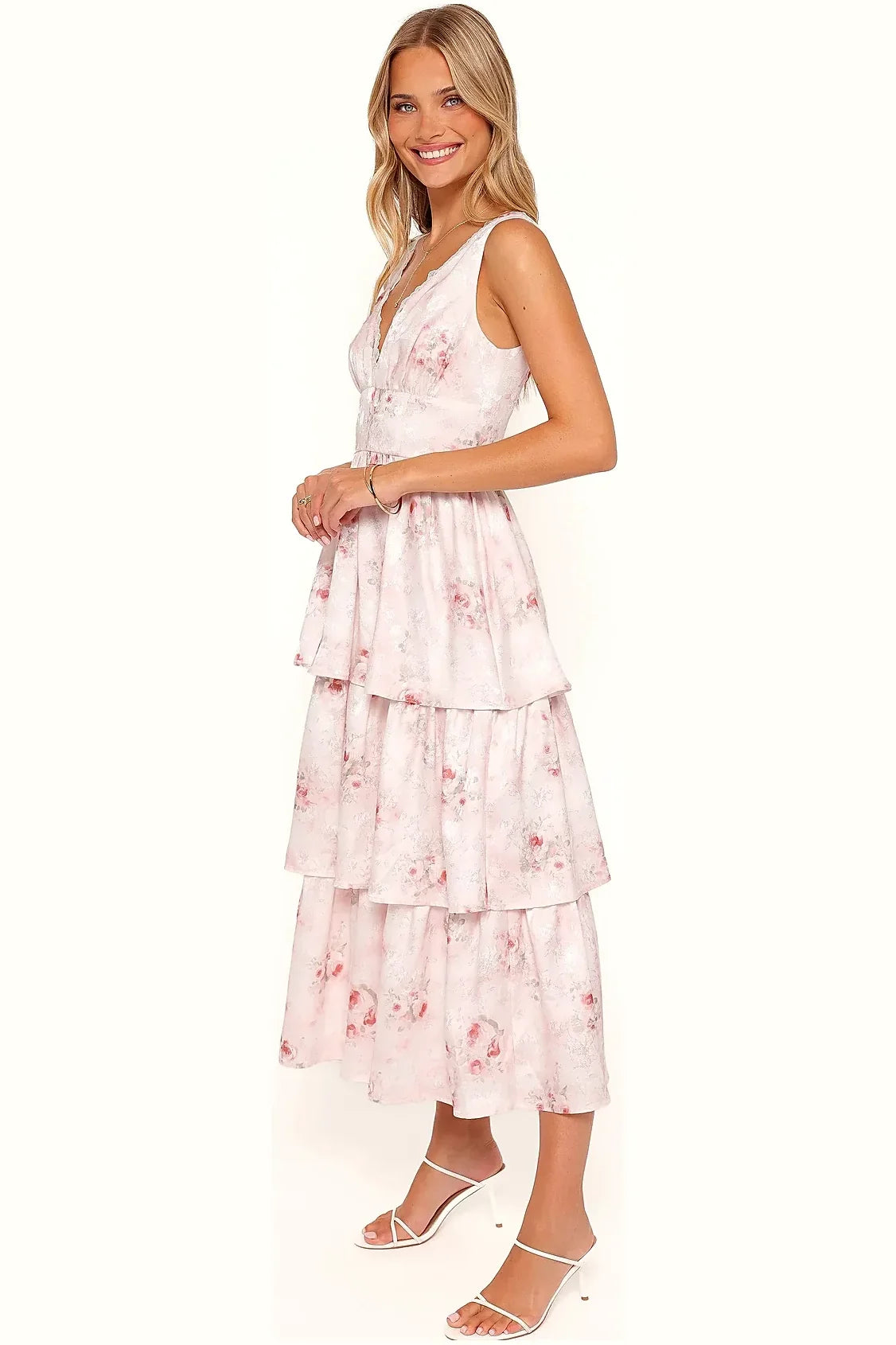 Back view of a white and pink floral v-neck maxi dress
