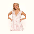 White satin maxi dress with a pink floral print