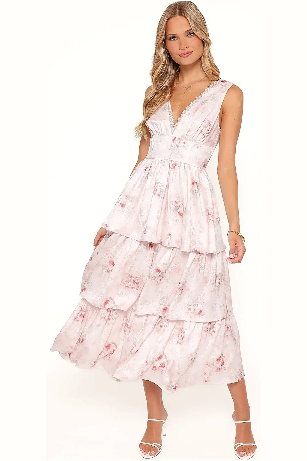 Side view of a long white and pink floral satin dress
