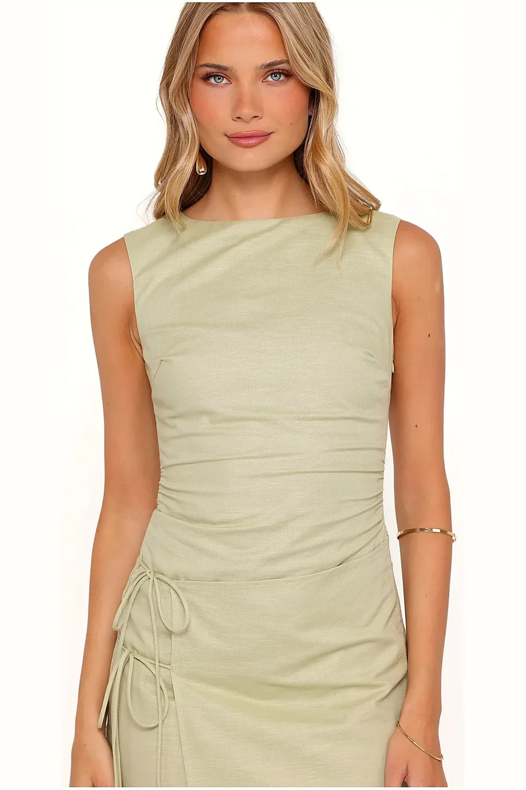 Model photo — green cotton mini dresse, front view on model
