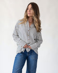 Navy and ivory vertical stripes on an oversized woven shirt