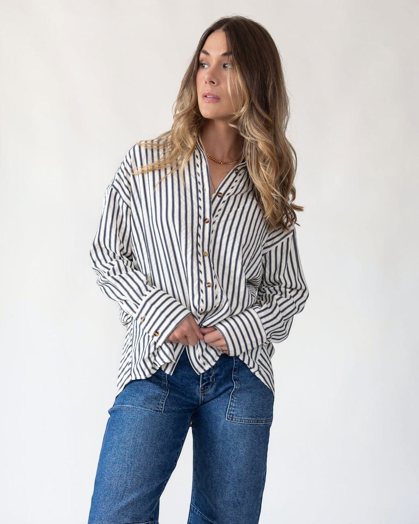 Navy and ivory vertical stripes on an oversized woven shirt