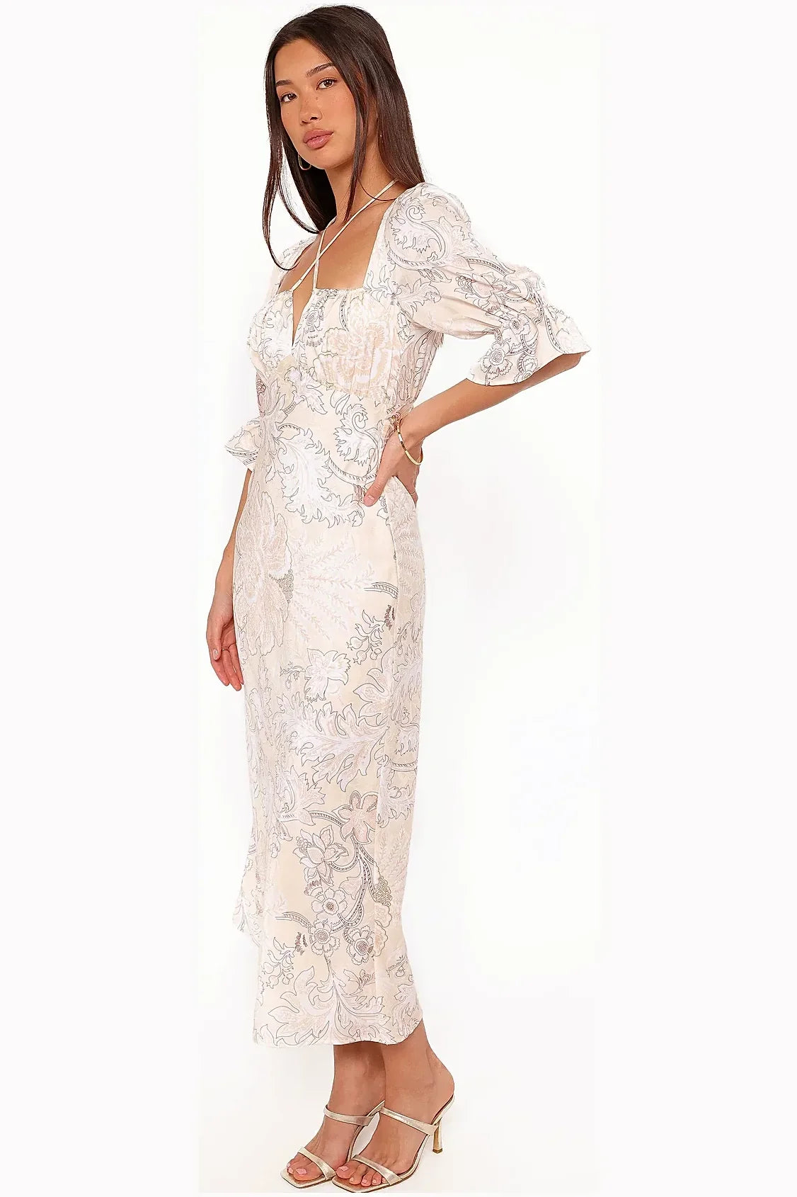 Side view of a long-sleeve pastel paisley satin dress