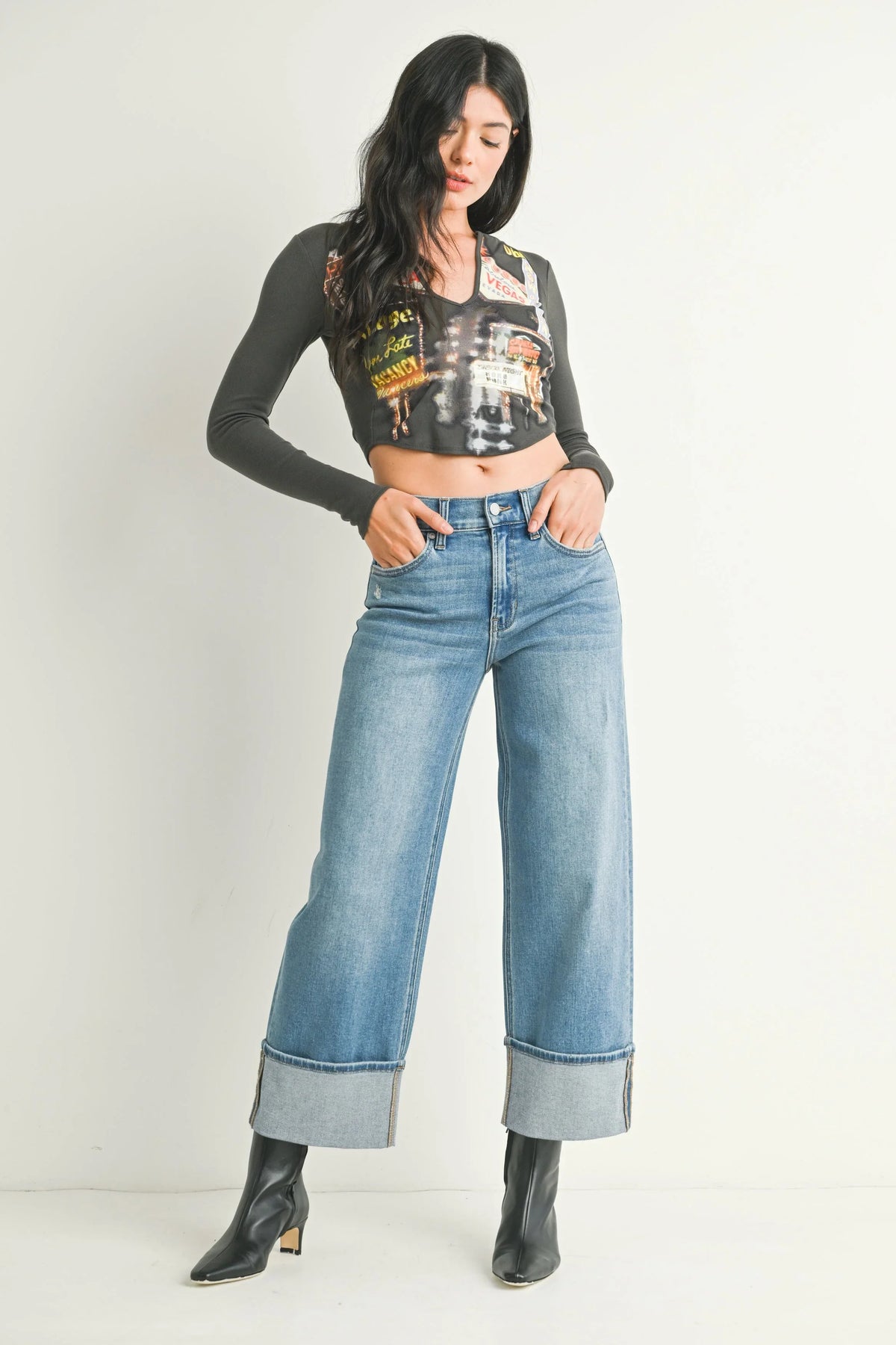 Cuffed hem turning up at the base of a wide-leg jean