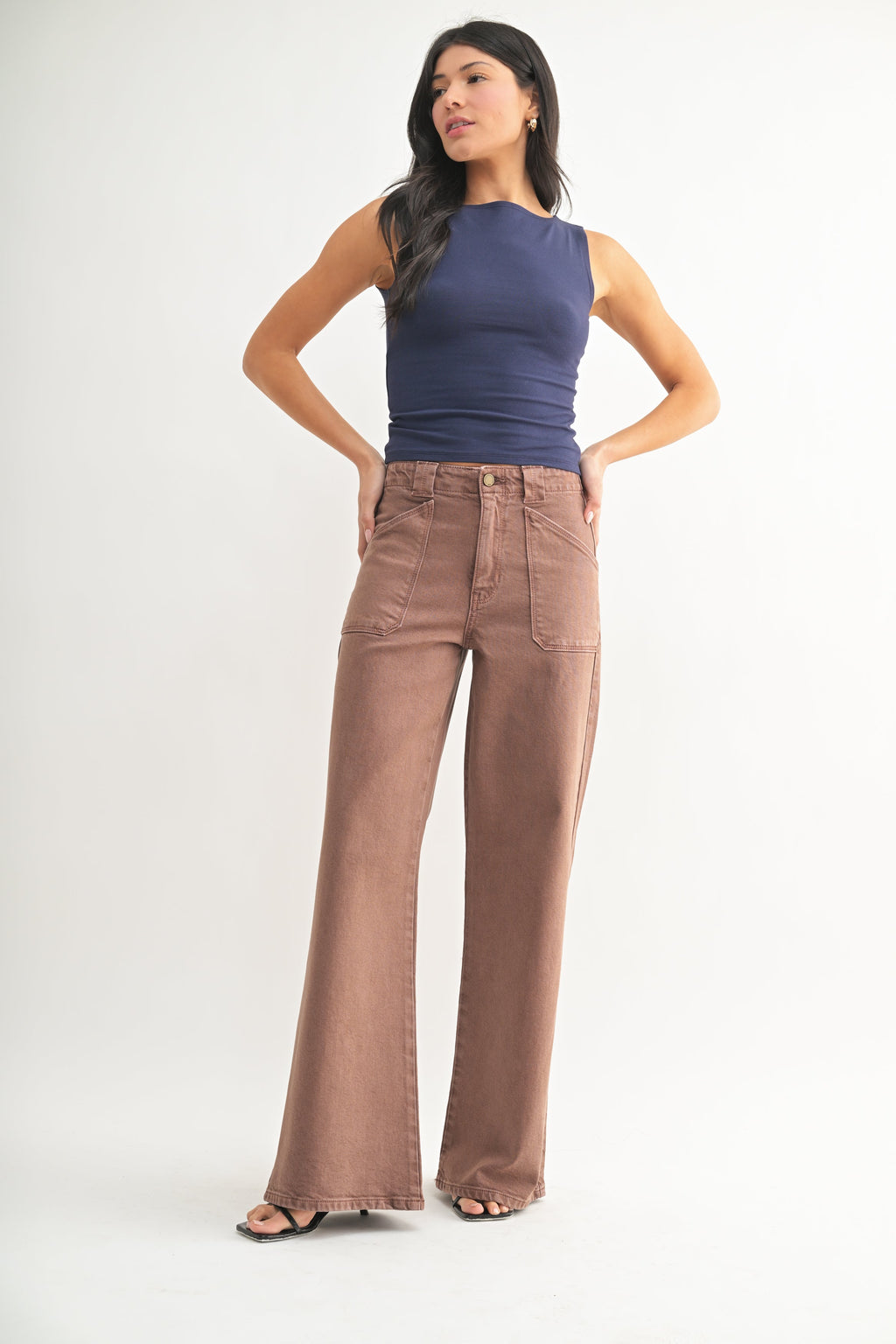 Functional patch pockets set on the front of a black jean