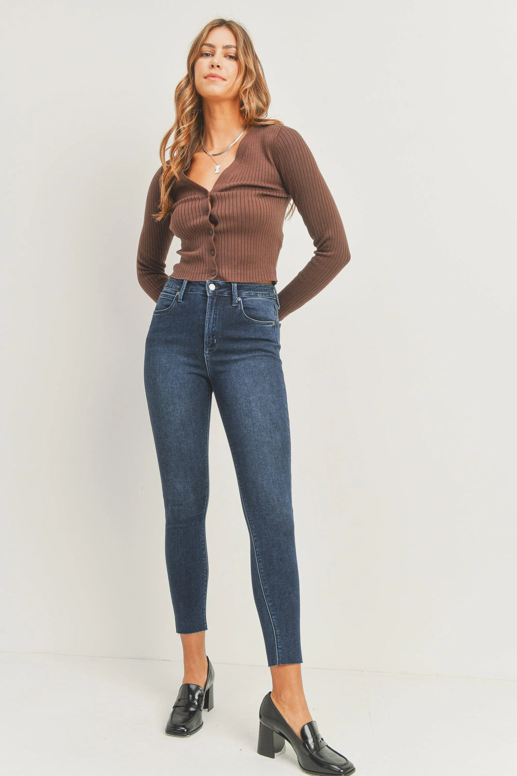 Scissor-cut hem sitting just above the ankle