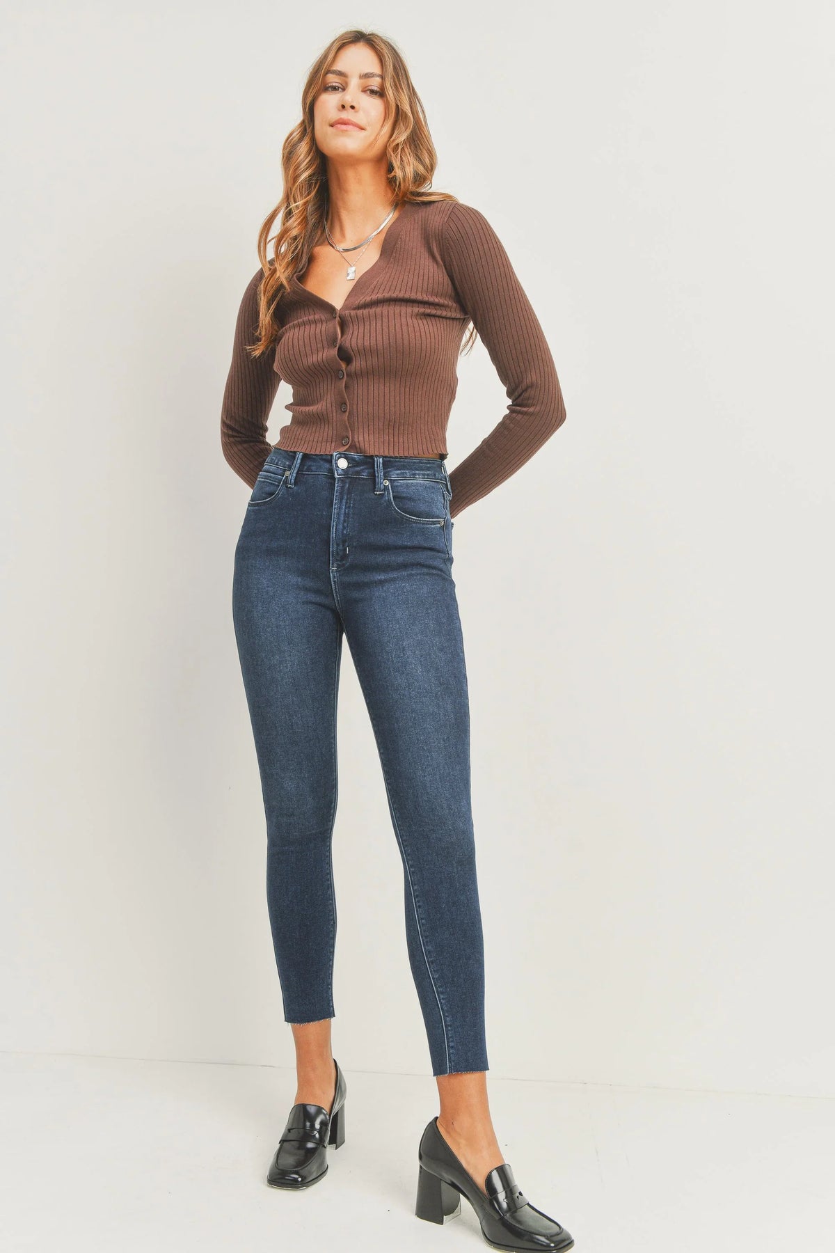 Scissor-cut hem sitting just above the ankle