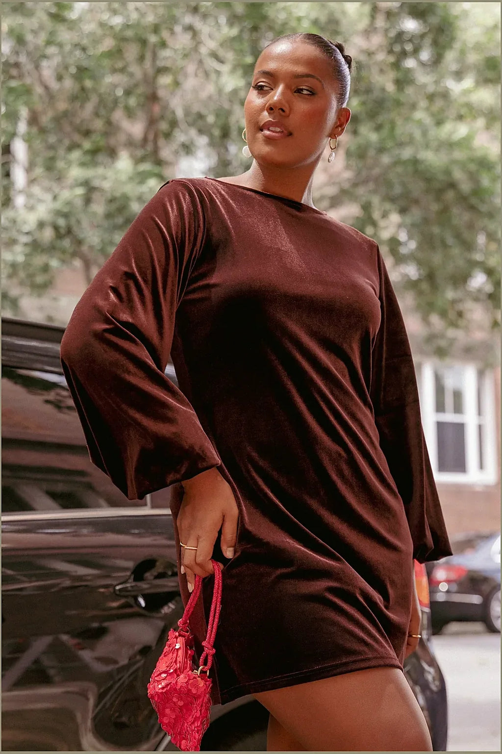 Model photo — brown velvet mini dresse, back view showing the closure