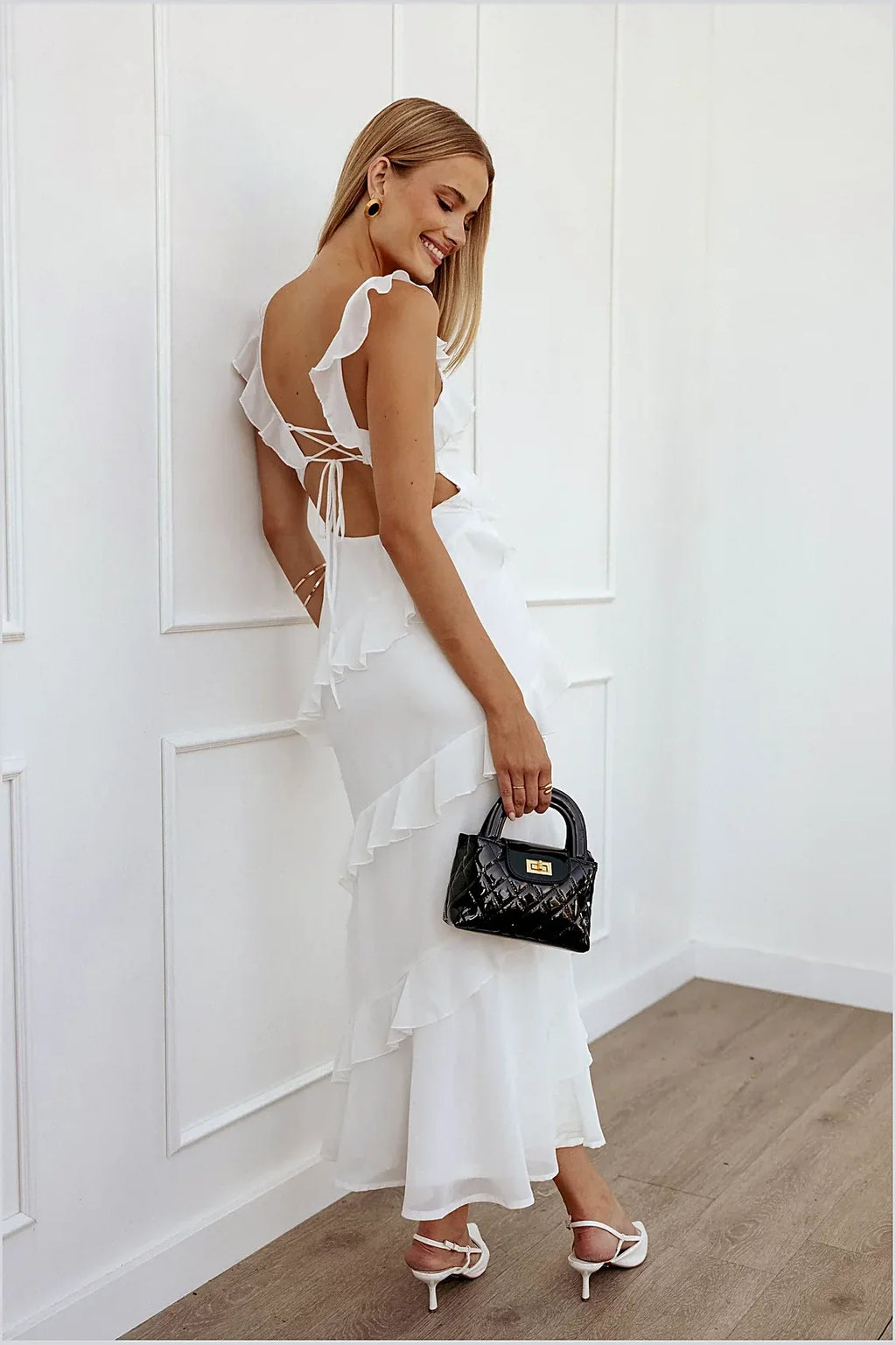 Back view of the white lace v-neck maxi dress
