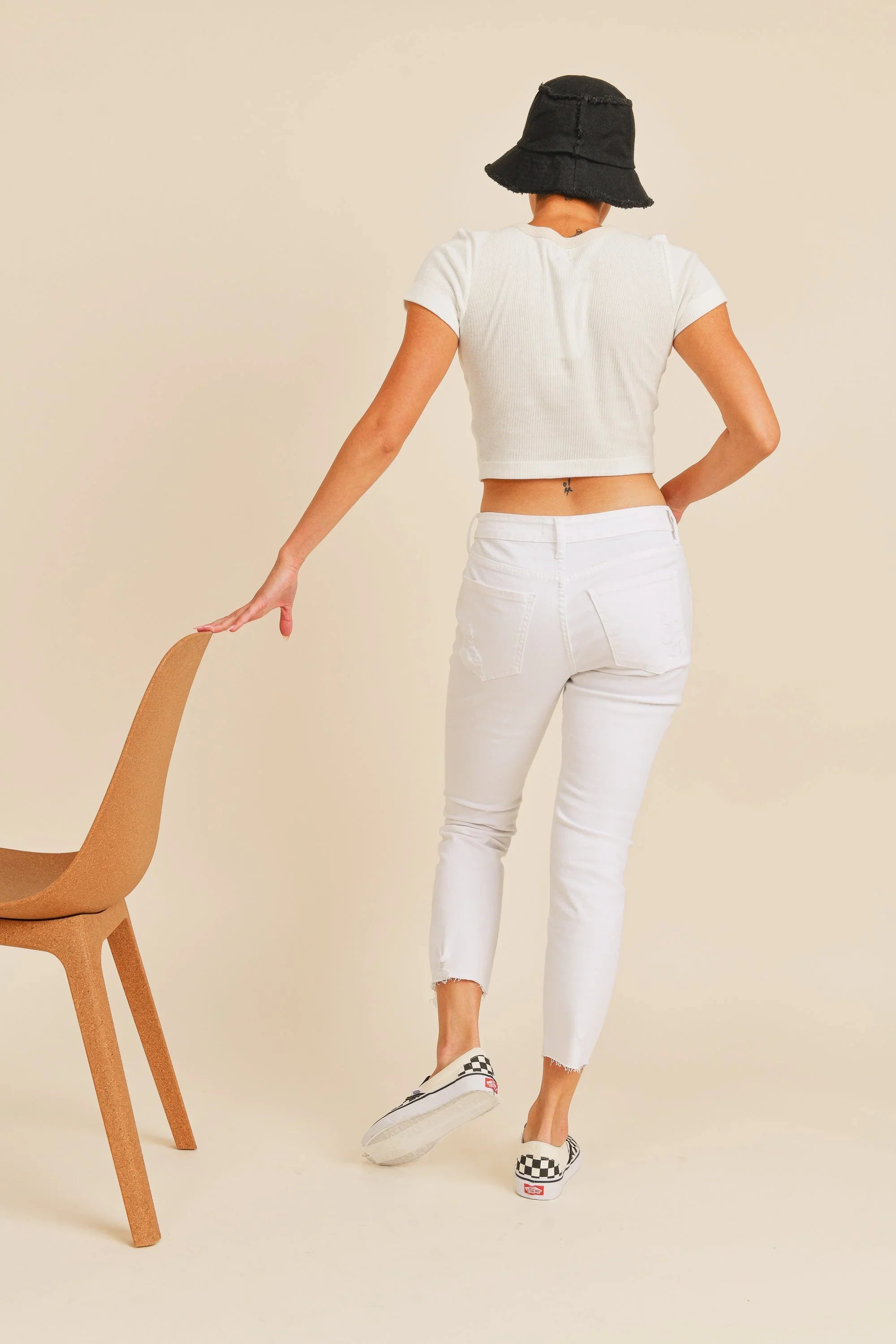 Cropped above the ankle with distressed detailing