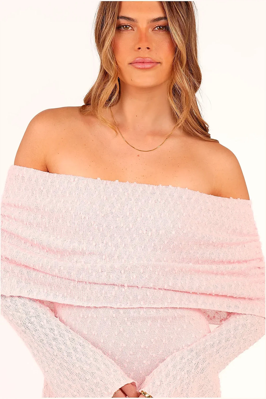 Back view of a pink off-shoulder bodycon dress