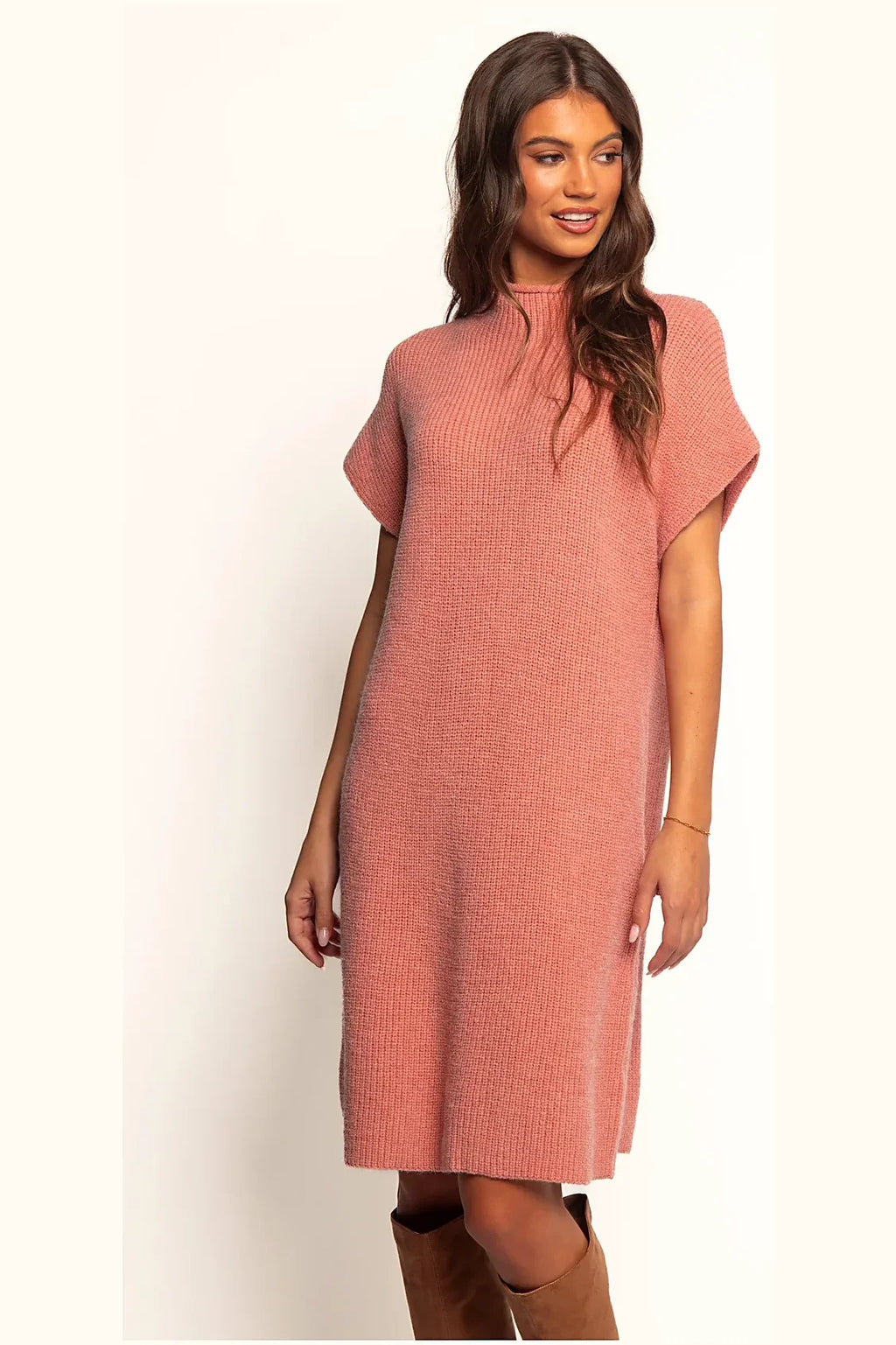 Sleeveless pink knit mini dress from the side